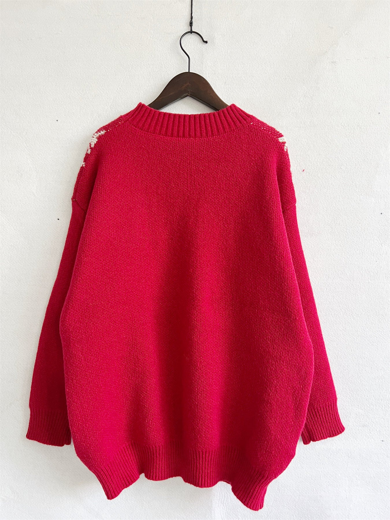 Pull de Noël rouge avec tête de Renne